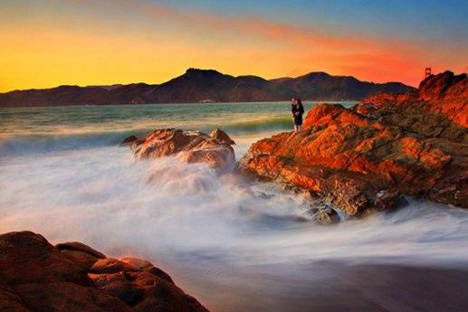 Taken at Baker Beach, San Francisco, for the couple's engagement session during sunset. They have to brave the water and cold weather and have to stand for few seconds without moving for this slow-shutter shot. This photo was also printed in life size and displayed during the 2010 WPPI (wedding and portrait photographers international) at las vegas.