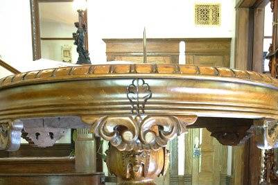 A most beautiful guest book table in the front entry of The BEALL MANSION. Solid walnut with hand carved griffins and marble inset top. Photo courtesy Cmax Photography Alton, IL 62002.