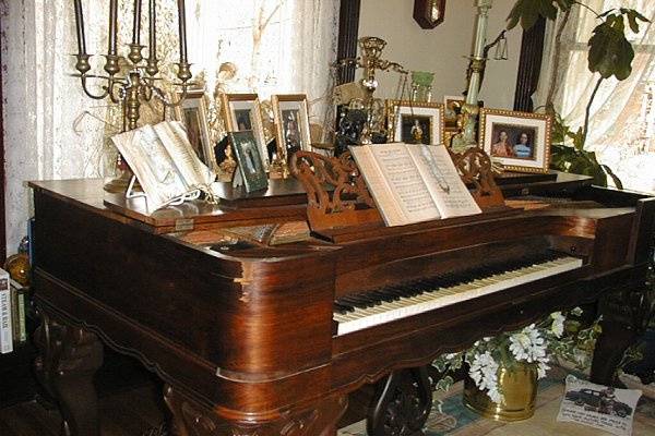 1859 box grand piano in the music room and library.