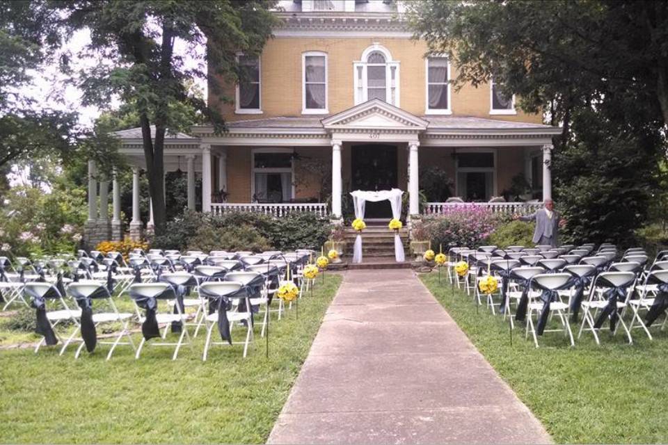 Wedding white chairs on the front lawn