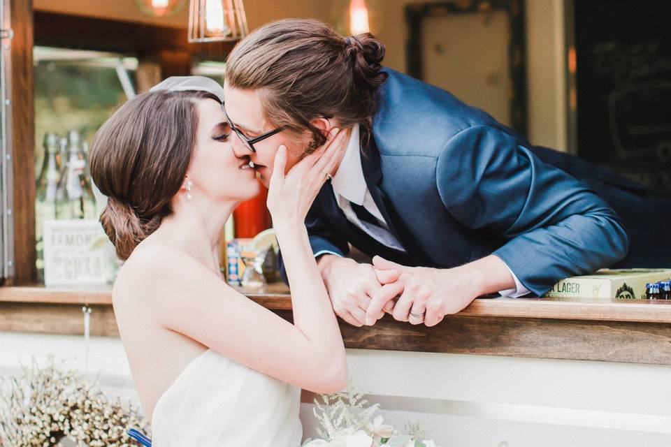 Stealing a kiss from the groom