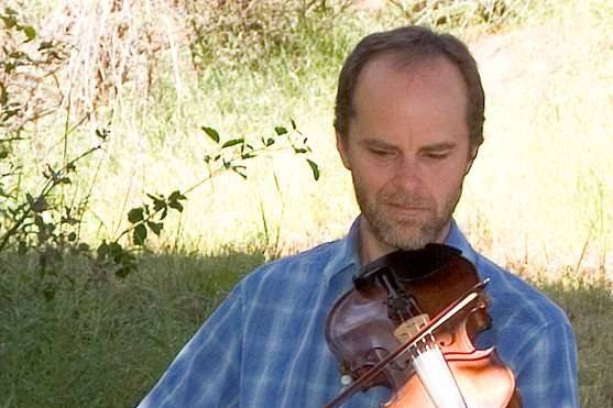 David plays Irish fiddle with The Crooked Road Ceili Band.