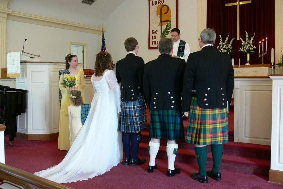 Custom kilts in each gentleman's family tartan, rented formal jackets & accessories for the guys.  The ladies are sporting sashes that show off their own family colors.  All from Irish Traditions