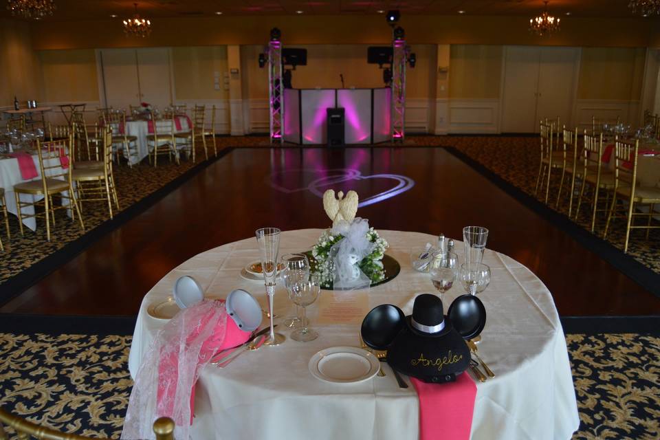 A look our setup in the North Room of the Dutchess Manor in Beacon, NY.  Two hearts being projected on the dance floor by us.  Pink up lighting on our system to match our couple's color scheme.  Can you tell they were Disney fans?
