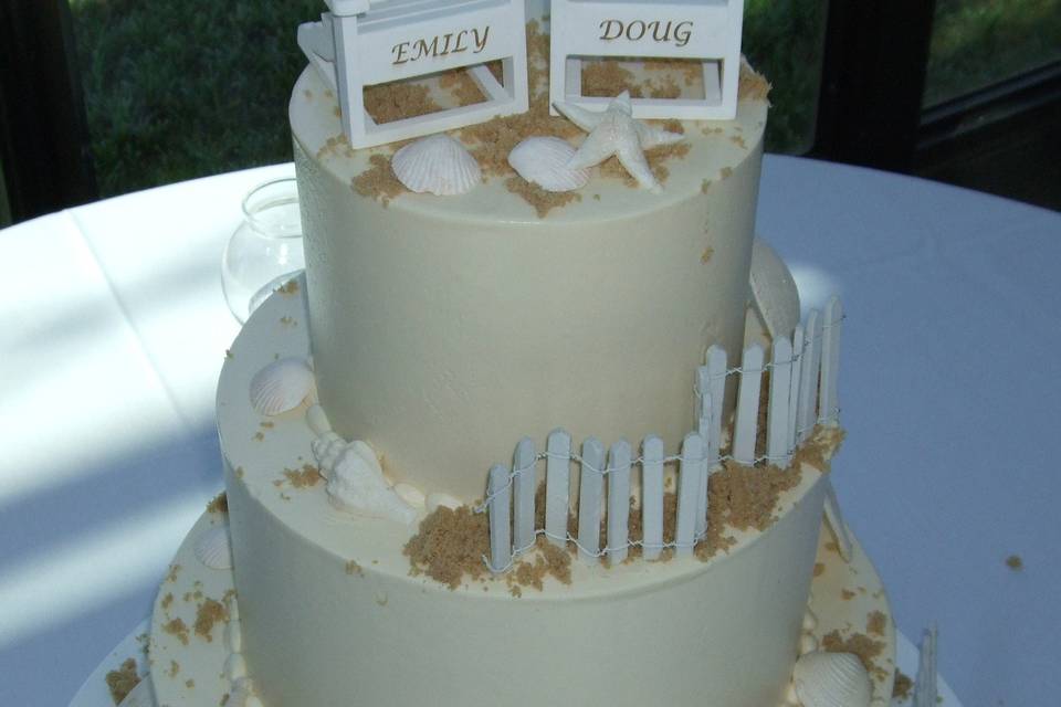 White cake with gold flakes