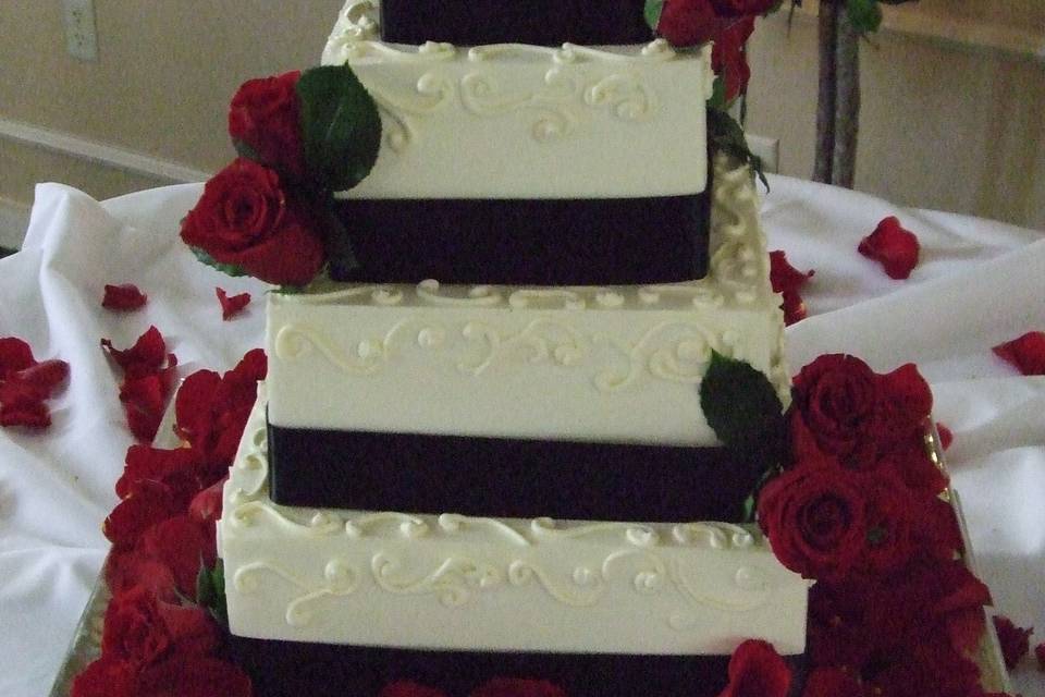 Square cake with black ribbons