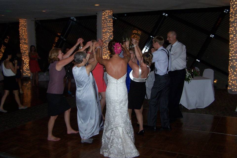 Bride dancing with friends