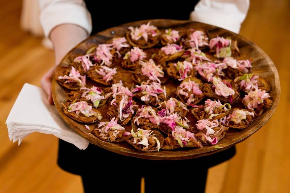 Pulled pork on house made chip with vinegar slaw