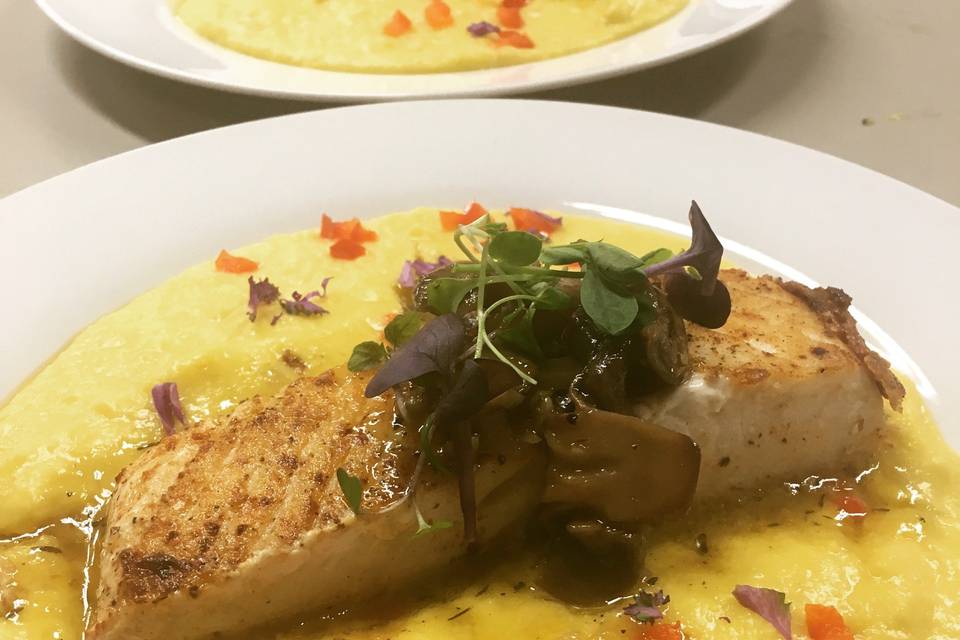 Grilled halibut over corn pudding with a warm wild mushroom vinaigrette