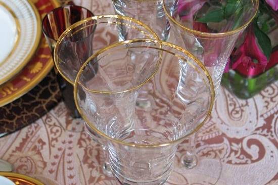 Charger plate, gold rim stemware and more