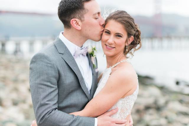Groom kissing his bride