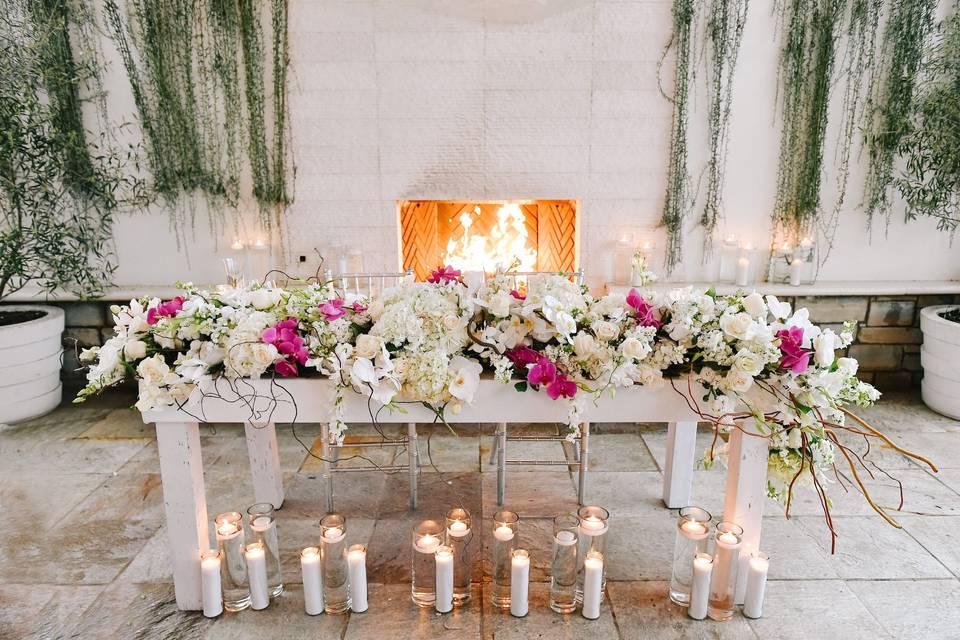 Pink and white sweetheart table at monarch beach resort wedding
