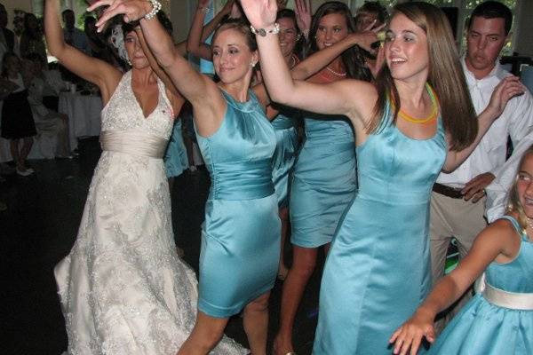Dancing bride and bridesmaids