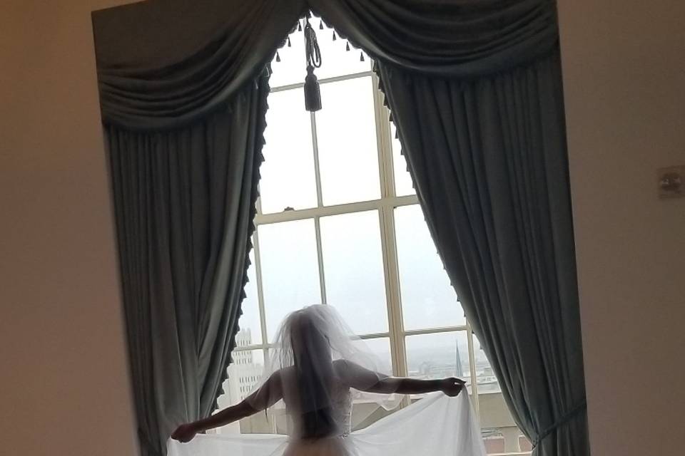 Bride gazing out the window