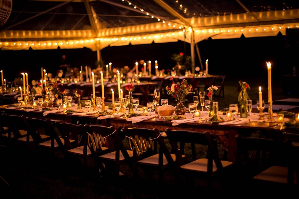 Candlelit tables and tent lighting