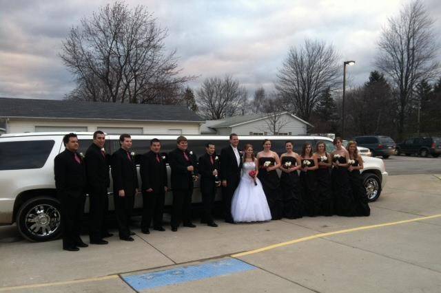 The newlyweds with the wedding attendants