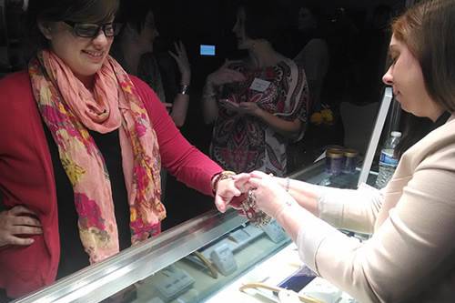 Our sales rep, Cara sizing a customer's finger