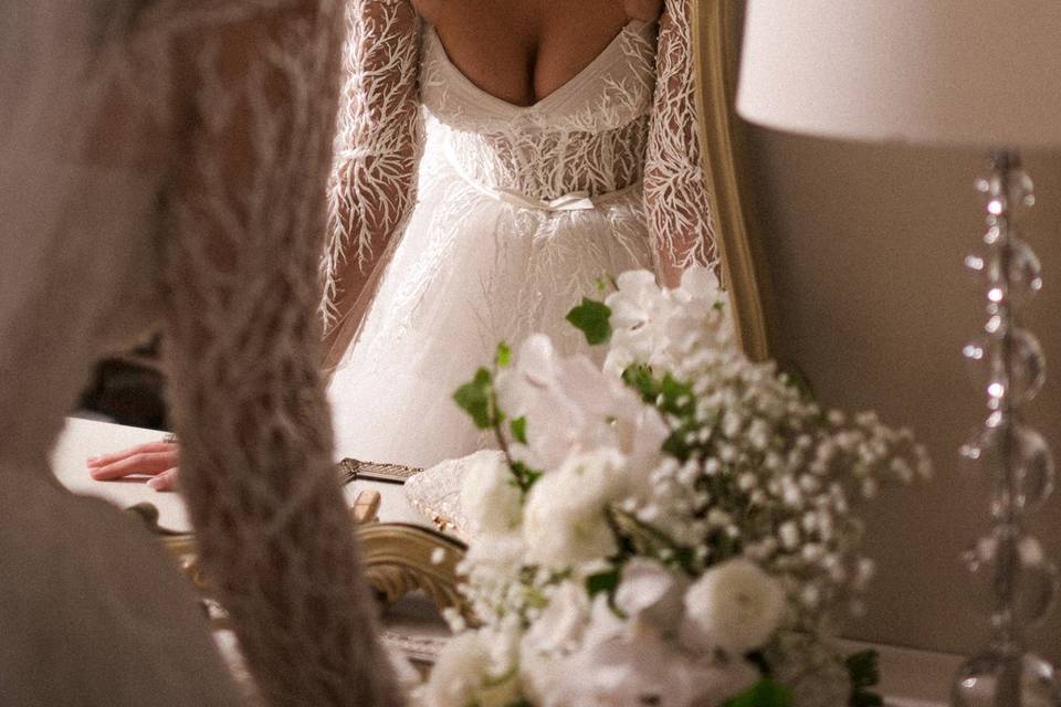 Bride looking in mirror