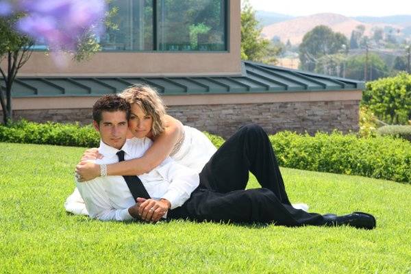 Edna Valley Vineyard bride & groom lounging lawn