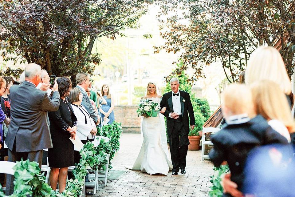 Bride escorted down the aisle