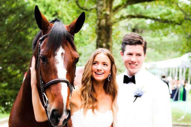 Couple posing with a horse