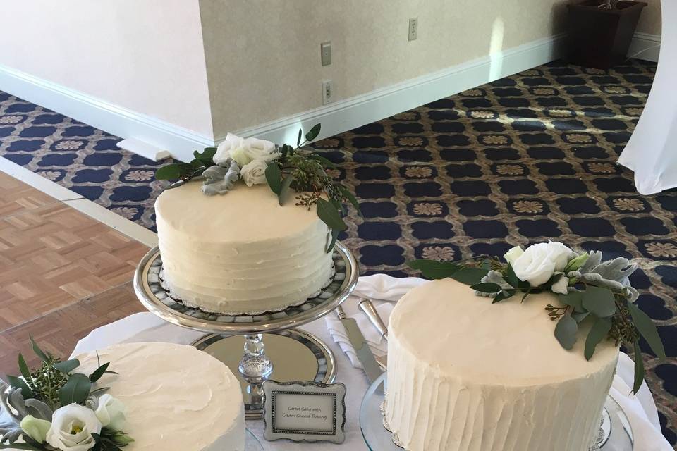 Three white wedding cakes