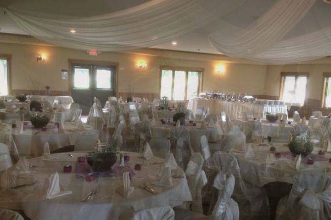 Wedding reception area with white table set-up