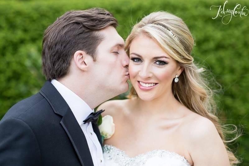 Groom kissing his bride