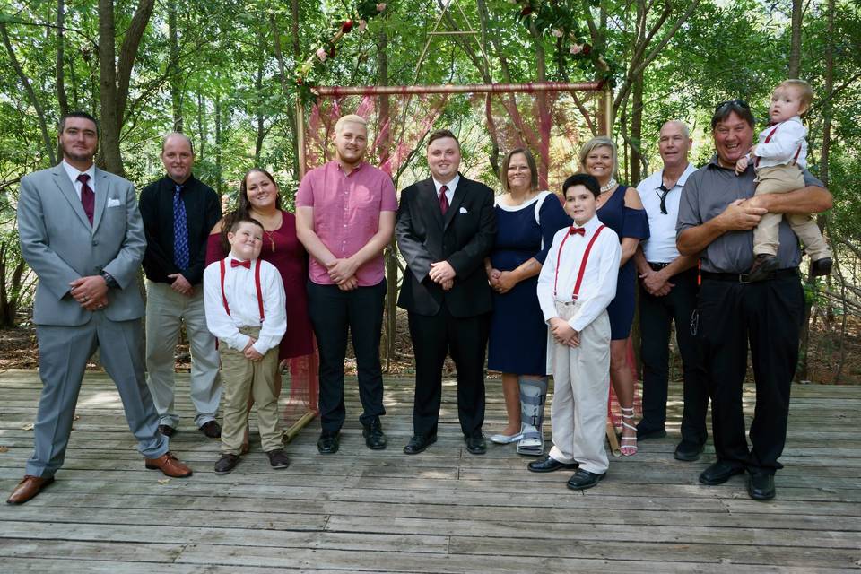 Groom supported by his loving family.