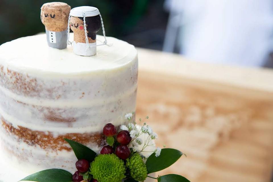 Naked wedding cake with figurines