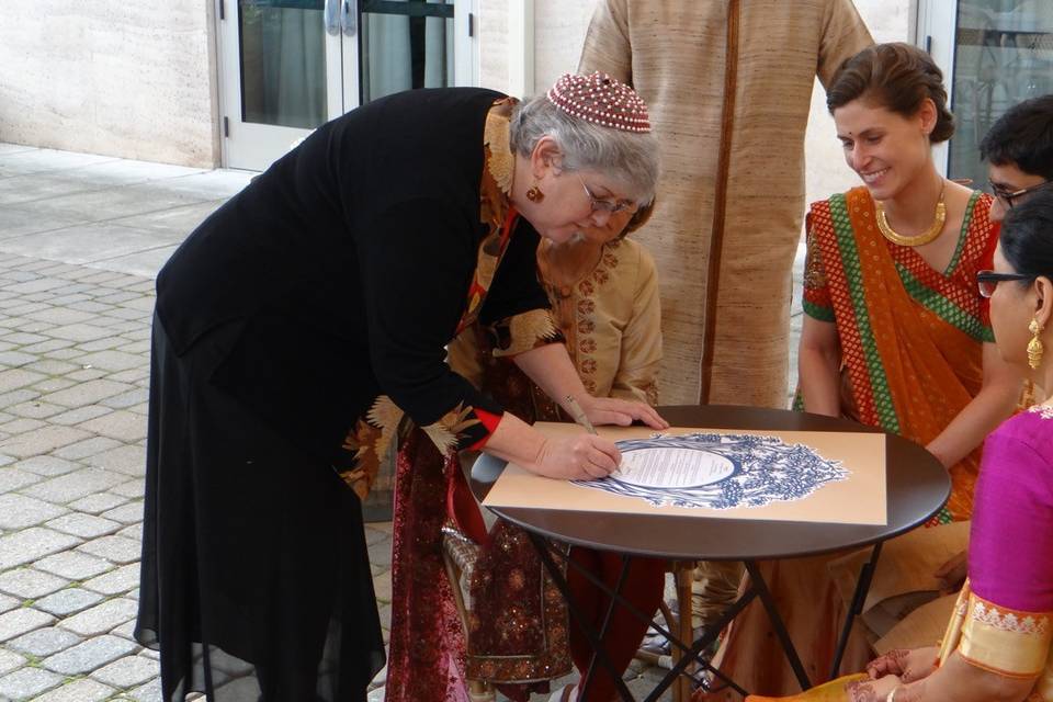 Signing the ketubah.