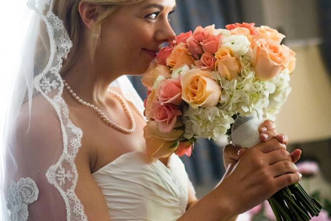 Bride smelling her bouquet