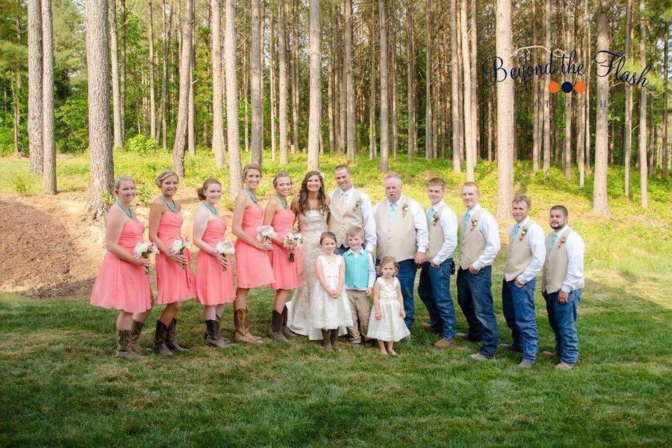 The couple with the bridesmaids and groomsmen