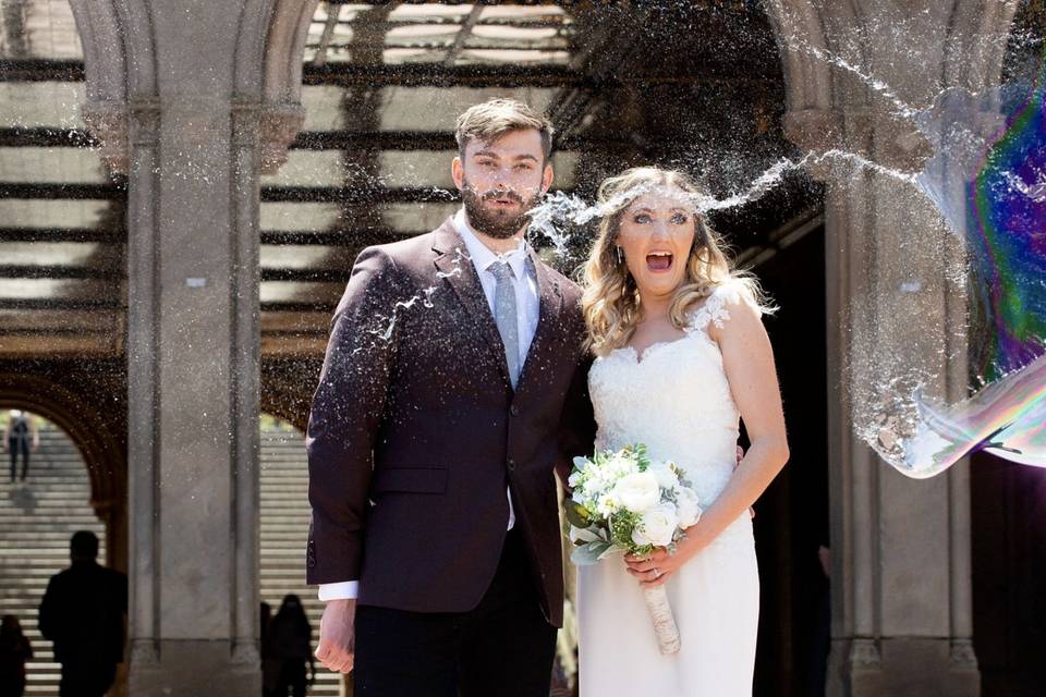 Photo by kristy may - our elopement love birds enjoying the bubble man at bethesda fntn