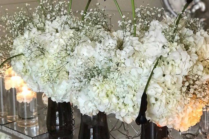 Red floral decors on reception table