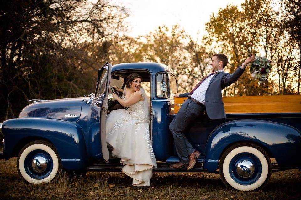 Bride and groom on the truck