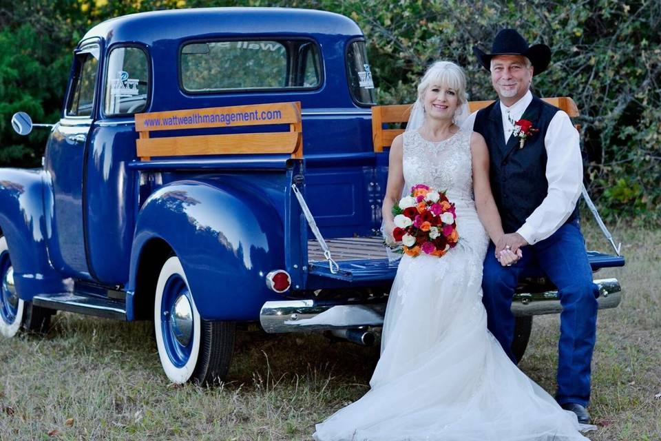 Newlyweds by the truck