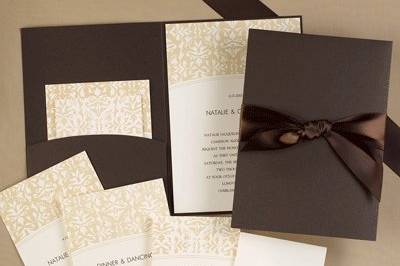 Intricate MochaAn intricate mocha wrap with a mocha ribbon ties in the details for your wedding day!