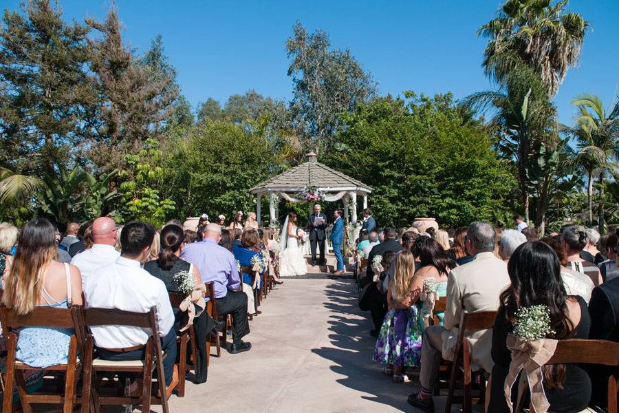 Exchanging vows by the gazebo