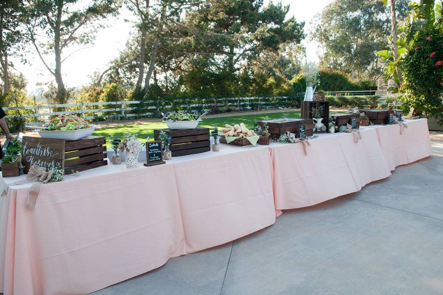 A buffet with peach linens