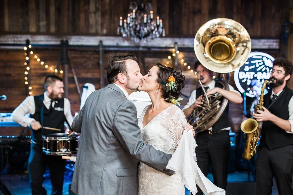 Playing music as the newlyweds kiss