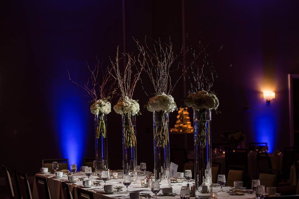 Table floral centerpiece with blue lighting
