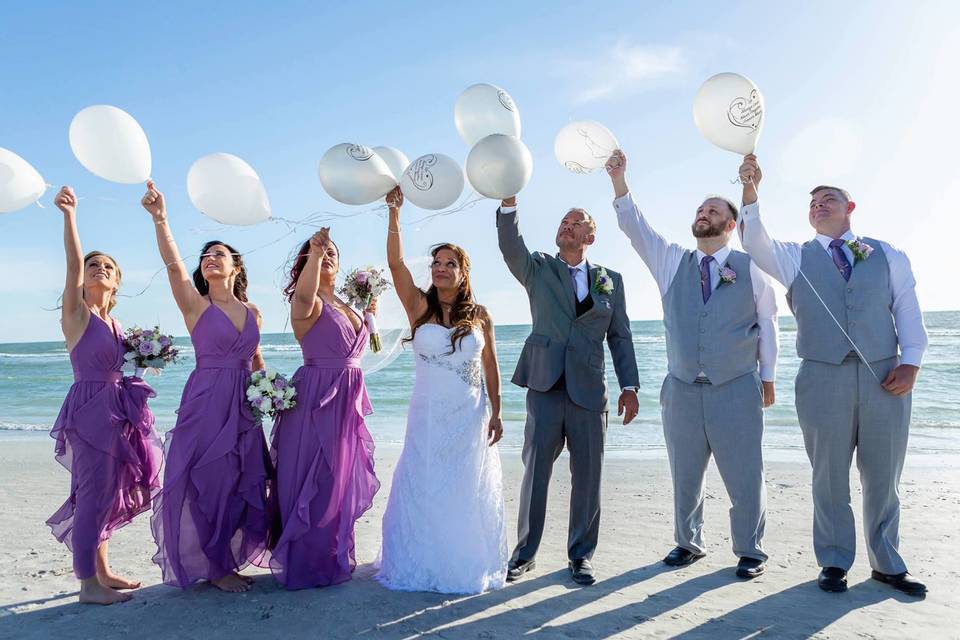 Newlyweds with bridesmaids and groomsmen