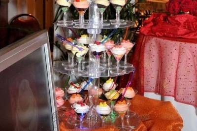 Martini Mini-Cupcake tower.  This was a hit at the show.  The clear acrylic stand was lit with mini white lights through the centre, with changing coloured lights at the base.  The mini martini cocktail glasses held jellybeane, cupcake topped with butercream frosting, more jellybeans and a cocktail fork.