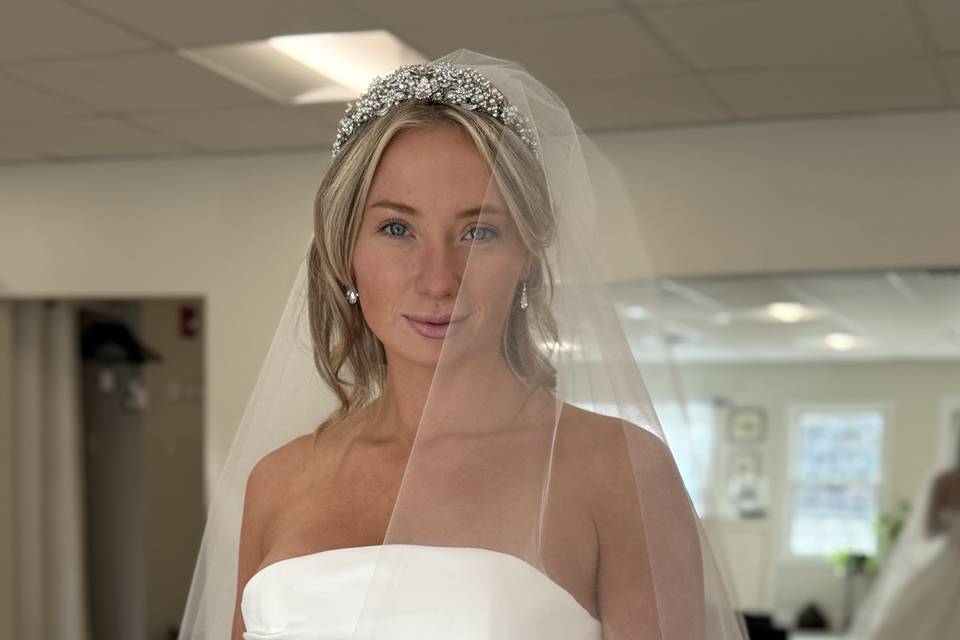 Dress by Rivini, veil by Paris