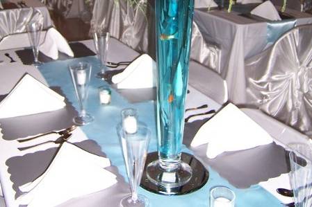 Pilsner vase with smaller white arrangment.