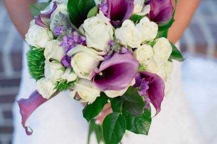 Purple and White Bridal Bouquet with calla lilies, roses, spray roses, trachelium, stock and lemon leaves.