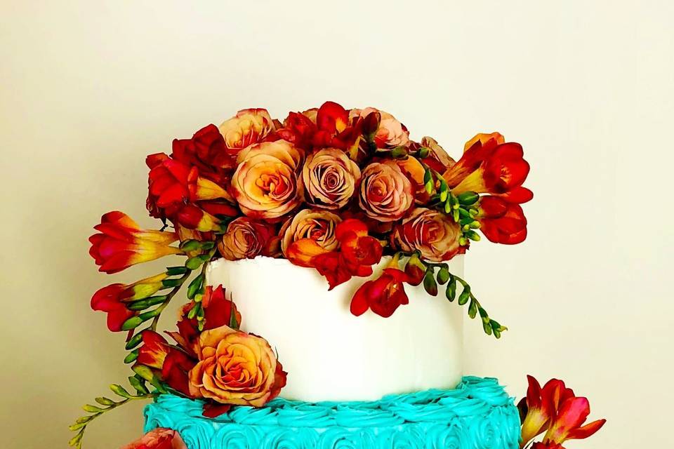 4-tier wedding cake with turquoise tiers