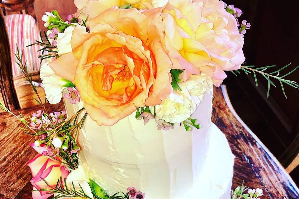Cascading flowers on cake