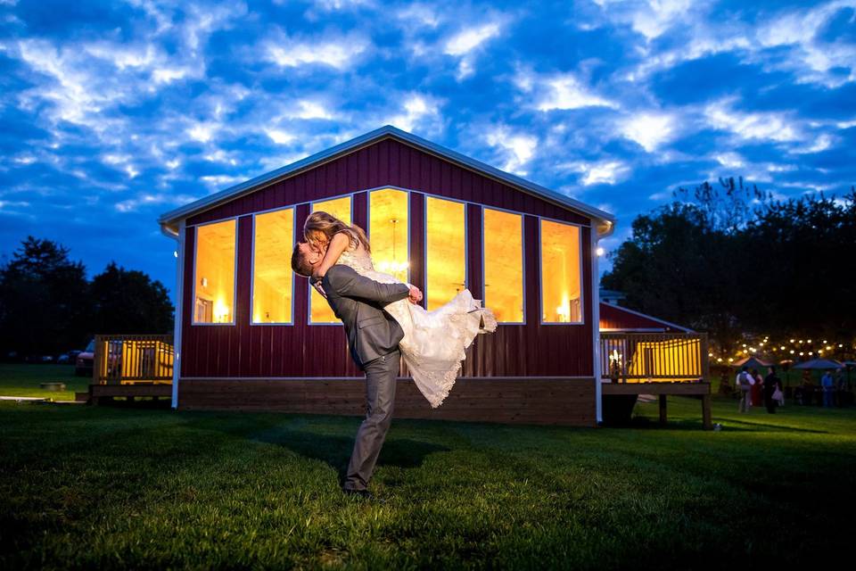 Groom lifting his bride